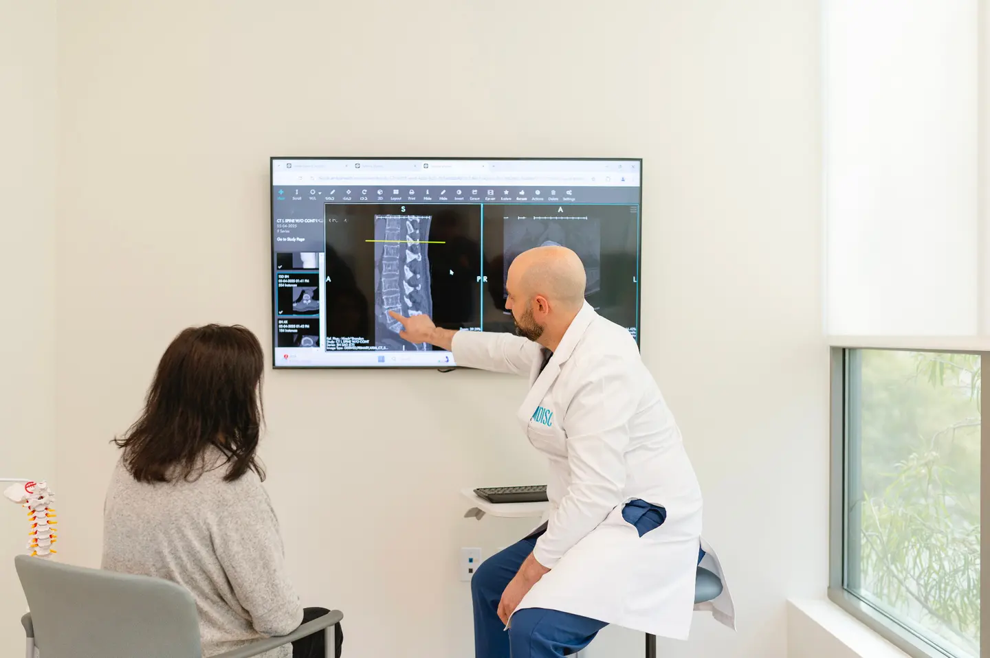Dr. Hirsch reviewing a patient's MRI images